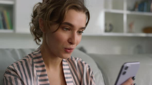 App Customer Holding Smartphone at Home Closeup alt