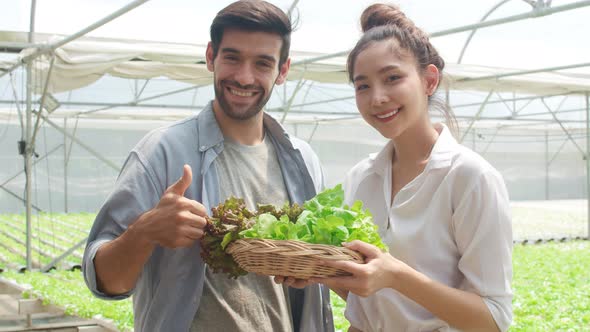 Young Asian businesswoman farmer product selling  good quality plant and vegetable.