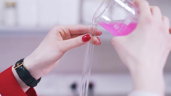 a Scientist Pours Liquid Into a Test Tube