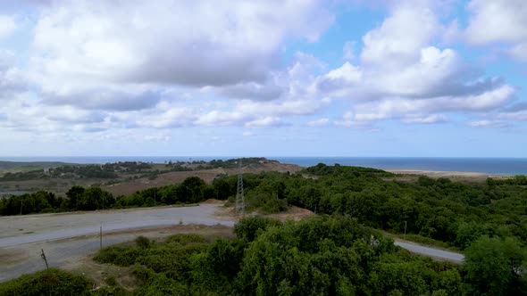 Drone flight over the north Istanbul forest. Cloudy sky, blue sea and green nature alt