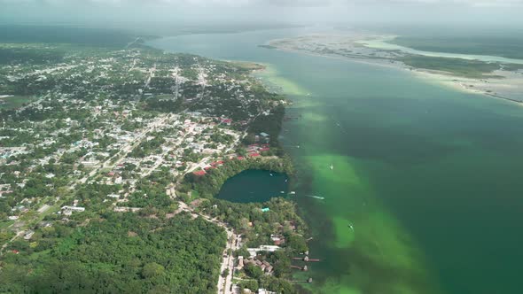 Drone view of the amazing Bacalar lagoon and the deepest cenote in the region, in Mexico alt