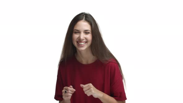 Beautiful Smiling Woman in Red Tshirt Laughing and Looking Grateful Thanking for Something Standing alt