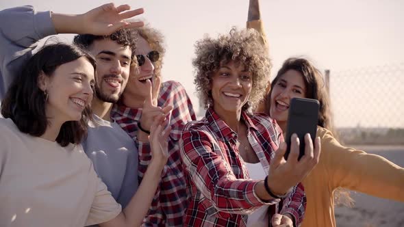 Group of Multiracial Happy Friends Taking Selfie and Having Fun Together alt