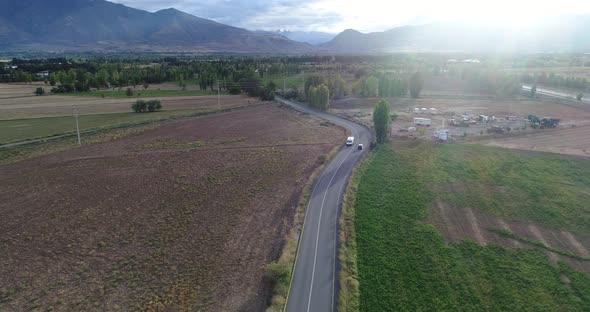 Aerial view on road. Highway through mountain valley.