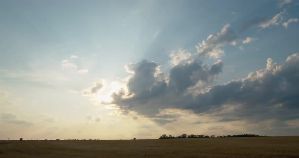 Beautiful Sunset Over a Mown Wheat Field