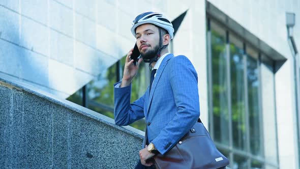 Bearded Businessman Outdoors Talking By Phone