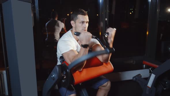 Bodybuilder Do Biceps Hand Muscles Workout Exercise on Training Weight Lifting Apparatus alt