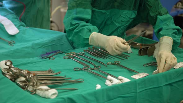 Surgery Nurse Is Organizing Surgical Instruments