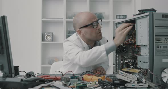 Careless technician repairing a computer