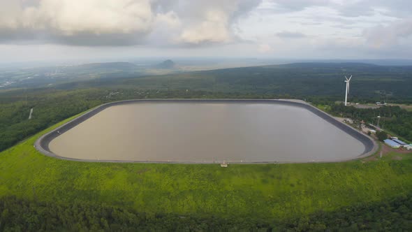 Aerial view of Lam Takhong Dam, Korat, Thailand. Reservoir dam and water in recycle energy alt