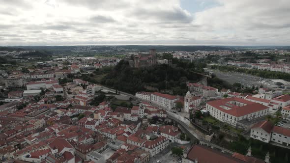 Historic castle of Leiria strategically perched on hilltop; aerial dolly in
