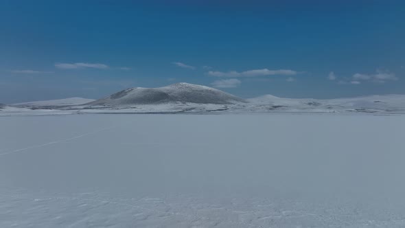 Aerial view of frozen Lake Madatapa in Javakheti National park, Georgia alt