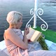 A Girl on a Raft Eats a Berry and Reads a Book - VideoHive Item for Sale