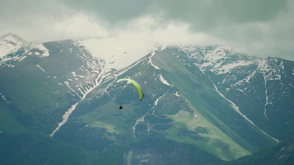 Paraglider Flying in the Mountains in Georgia