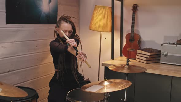 Female Rock Drummer With Sticks alt