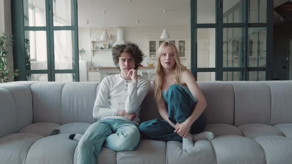 Couple Teens of Football or Sports Fans Watch TV at Home and Rejoice at the Victory alt