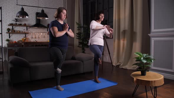 Curvy Disabled Girl with Mom Doing Yoga at Home alt