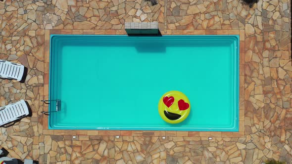 Float smile emoji emoticon icon buoy at swimming pool at countryside alt