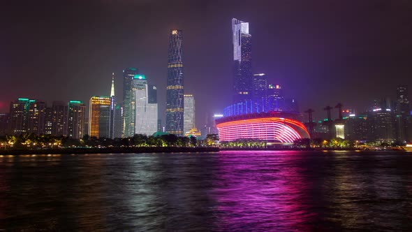 Guangzhou Night Business City Cityscape China Pearl River with Boats Traffic Timelapse Pan Up alt