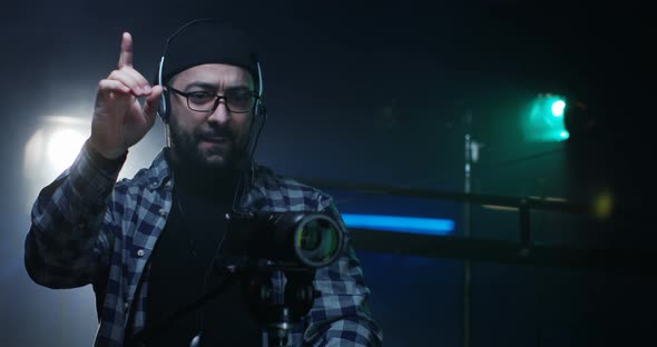 Young Director Giving Instructions on a Film Set alt