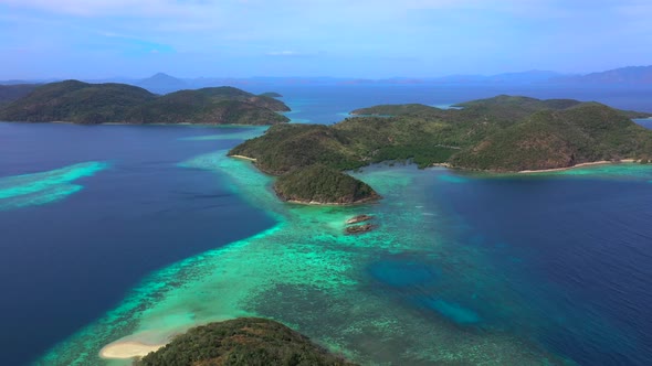 Panorama of Tropical Islands Surrounded By Turquoise Sea. Camera Move Back alt