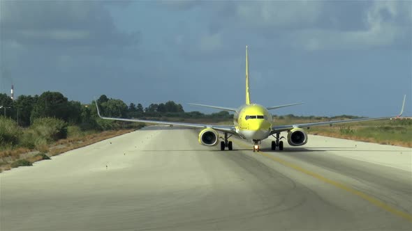 Commercial aircraft taxing to the tarmac after landing.