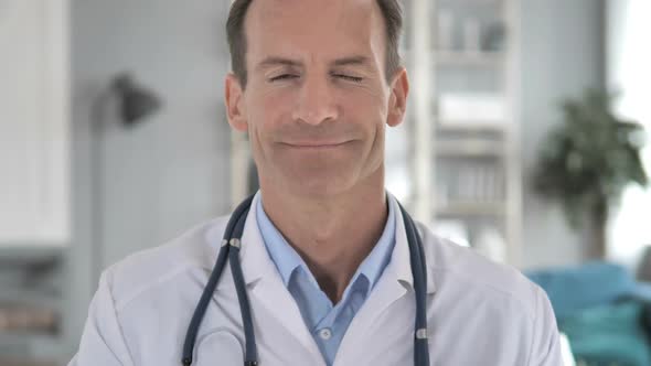 Yes Senior Doctor Shaking Head to Allow Patient alt