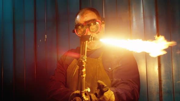 Male Welder Using Welding Torch alt