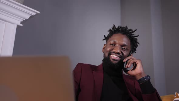 Young and Successful African American Businessman Talking on the Phone alt