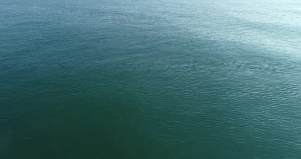 Drone video flight over ocean, sea. Close to the water alt