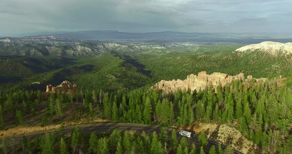 Aerial camera accompanies a white trailer on a highway (Zion National Park, Utah, USA) alt