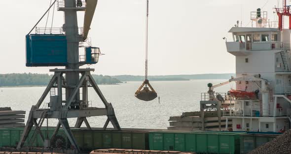 Port Crane Loads Coal To The Bulk Carrier