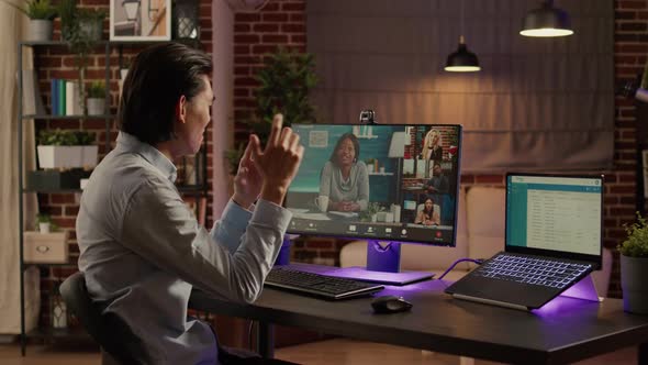 Asian Man Meeting with Business People on Remote Videocall alt