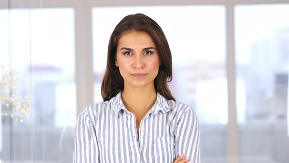 Angry Hispanic Woman Looking at Camera, Feeling Uncomfortable alt