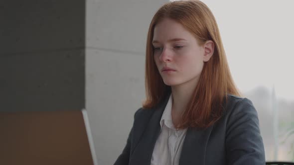 Pensive Woman Lawyer or Journalist is Reading Bad News in Internet and Thinking Working in Office or alt