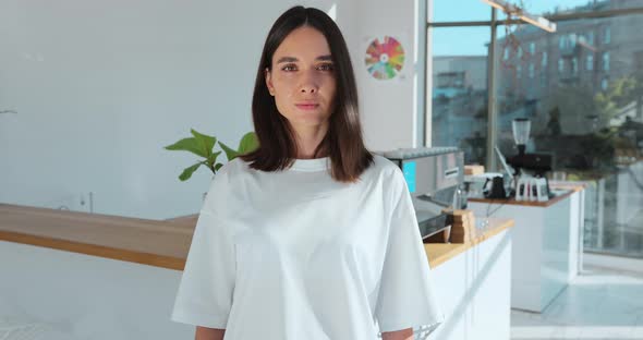 Portrait of Attractive Woman Bariata Standing in Opening Coffee Shop and Smiling Looking at Camera
