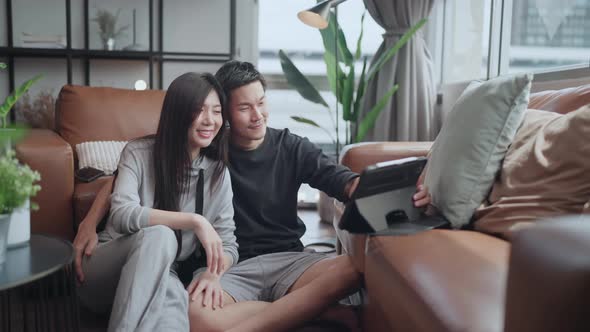asian marry couple wear casual cloth home isolate quarantine enjoy watching online movie alt