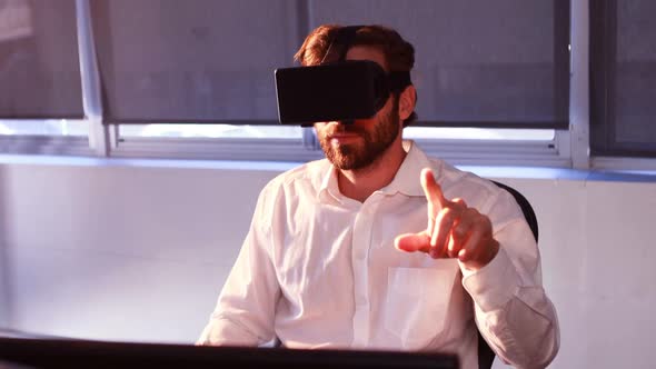 Businessman using virtual reality headset alt