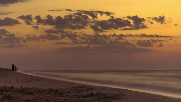 People and the Dawn of Sun on Sea, Silhouettes of People