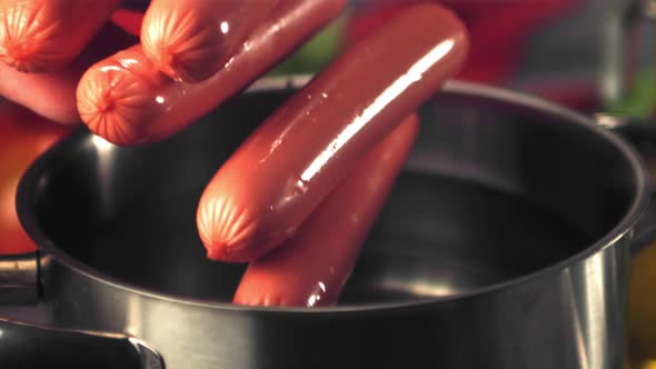 Super Slow Motion in the Pan Fall Sausages with Spray alt